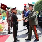 CDS Gen Chauhan Shaking Hands