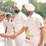 Vice Adm C R Praveen Nair Shaking Hands