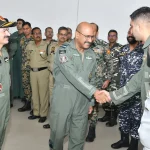 Air Marshal George Thomas Shaking Hands