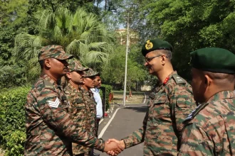 Maj Gen Manish Kumar Shaking Hands