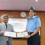 Justice Vijay Bishnoi Giving Award to Officer