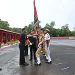 Officer Lifting Flag